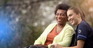 Female customer and care expert smiling