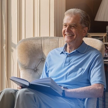 elderly man reading