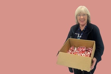 Care Expert holding gifts