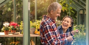 male customer and carer in greenhouse