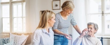 a Carer chatting with her elderly customer