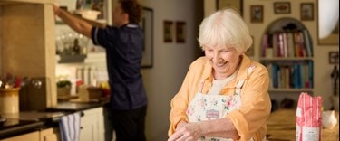 customer baking with care expert in background