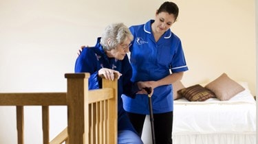 Carer client going up stairs