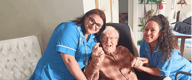 Roy a dementia customer enjoying time with his carers