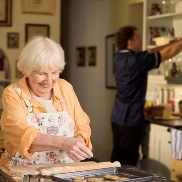 customer baking with care expert in background