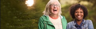 Care Expert and female customer walking outside