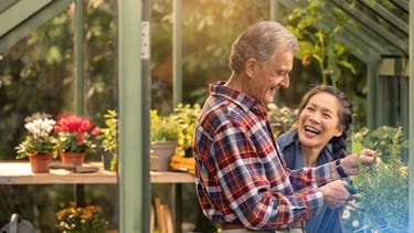 male customer and carer in greenhouse