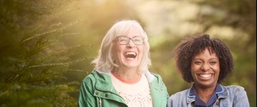 female customer and carer laughing in garden