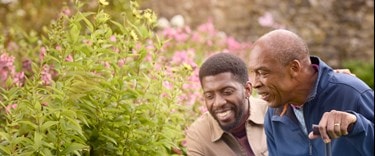 male customer and carer looking at flowers