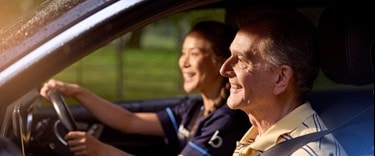 A carer taking an older customer to enjoy a day out