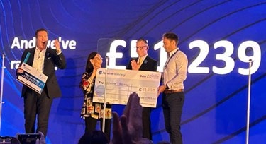 Dame Phillips received a check for Alzheimer's society
