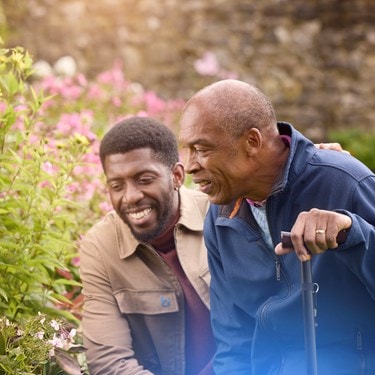 male customer and carer looking at flowers