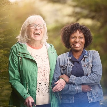 female customer and carer laughing in garden