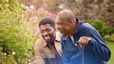 male customer and carer looking at flowers