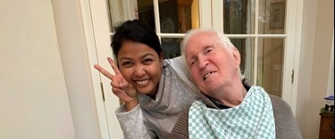 A live-in carer with her elderly stroke customer