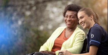 Female customer and care expert smiling