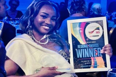 Care Expert holding award