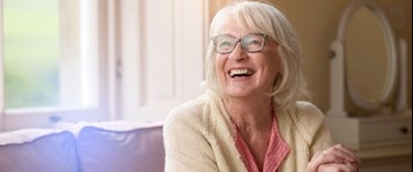 elderly lady at home smiling
