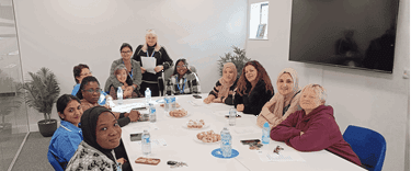 People sitting around the conference table with snacks