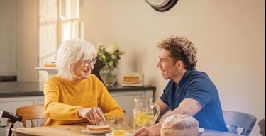 female customer and carer having breakfast