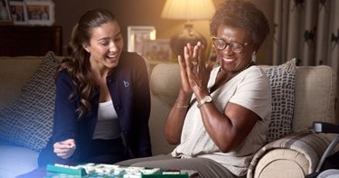 care expert and female customer playing scrabble