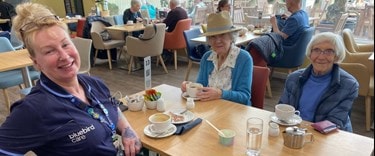 A carer out and about with elderly customers