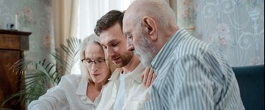 Family Looking At Family Photographs