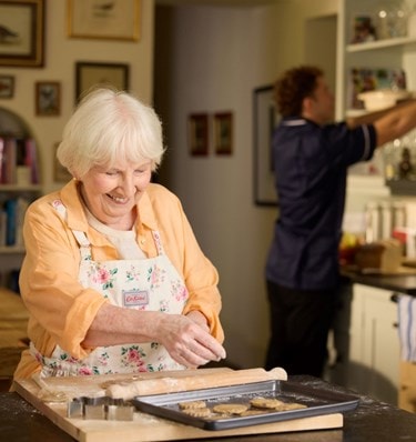 customer baking with care expert in background