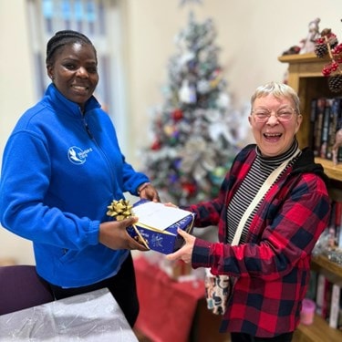 Bluebird Care Mansfield & Ashfield team delivering Christmas gifts to customers at home