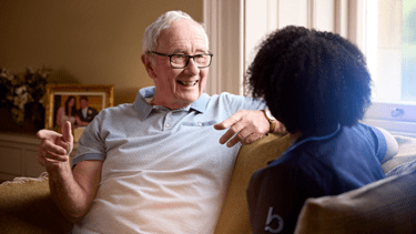 Man talking with carer
