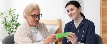 carer checking costs with an elderly