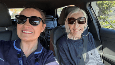 Customer in the car with carer