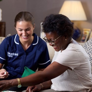 care expert and female customer playing scrabble