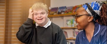 Special needs child with a carer