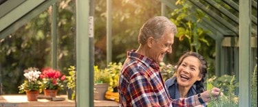 male customer and carer in greenhouse