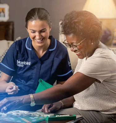 Bluebird Care Barnet carer helping elderly person in their home