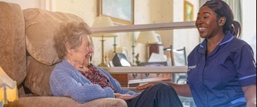 Bluebird Care care expert talking to a female customer