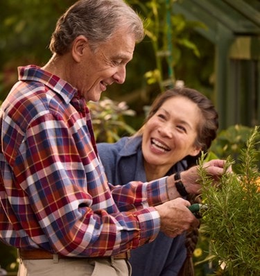 male customer in greenhouse with live-in care expert