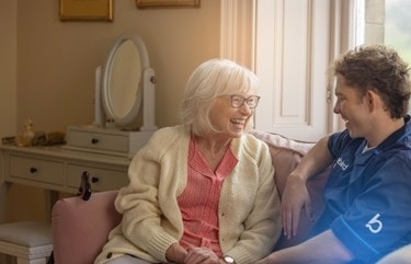 Care Expert sitting with customer
