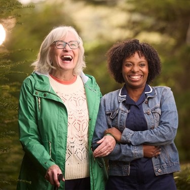 Care Expert and female customer walking outside