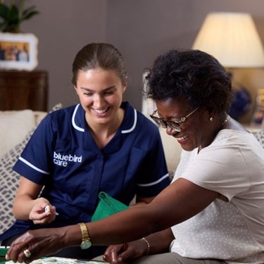 care expert and female customer playing scrabble