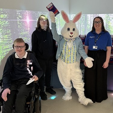 Bluebird Care surprises pupils at Hollywater School in Bordon with a visit from the Easter Bunny