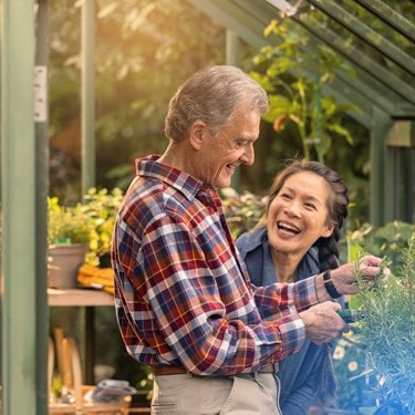 male customer and carer in greenhouse
