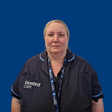 Image of Sharon, Our lead care expert, on a blue background