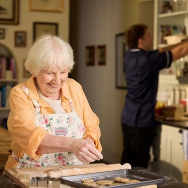 customer baking with care expert in background