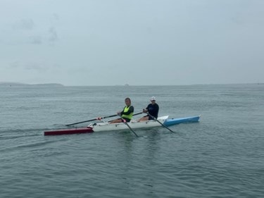 Hugo and his son rowing from Portsmouth to Lymington