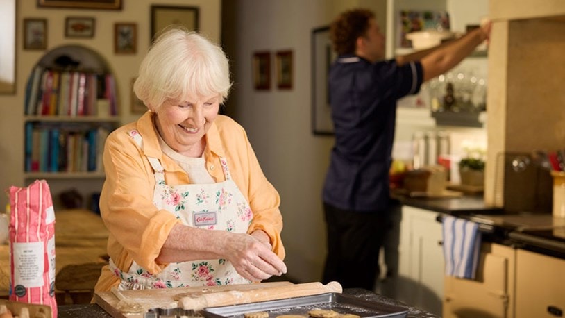 customer baking with care expert in background
