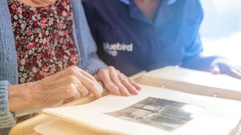 Caregiver supporting woman with early signs of dementia