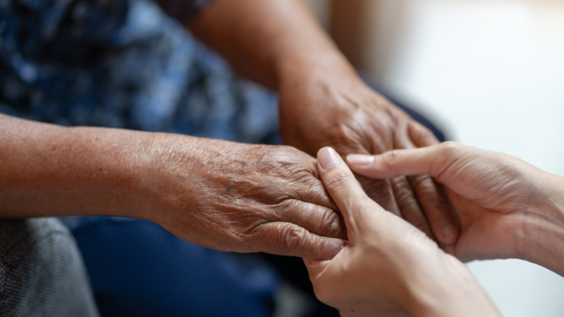 carer looking at patients feet