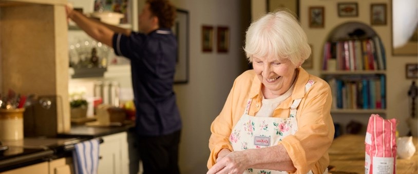 customer baking with care expert in background